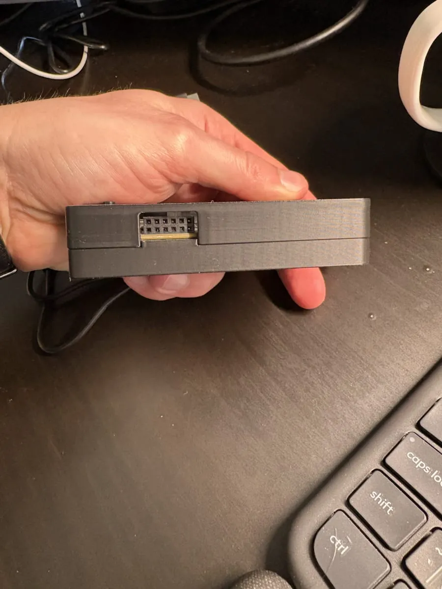 Side cutout in the 3D printed enclosure that keeps the STM32 header pins reachable