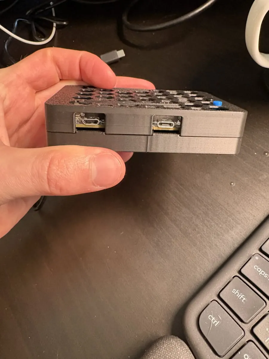 Opposite side of the 3D printed enclosure showing two exposed micro USB ports